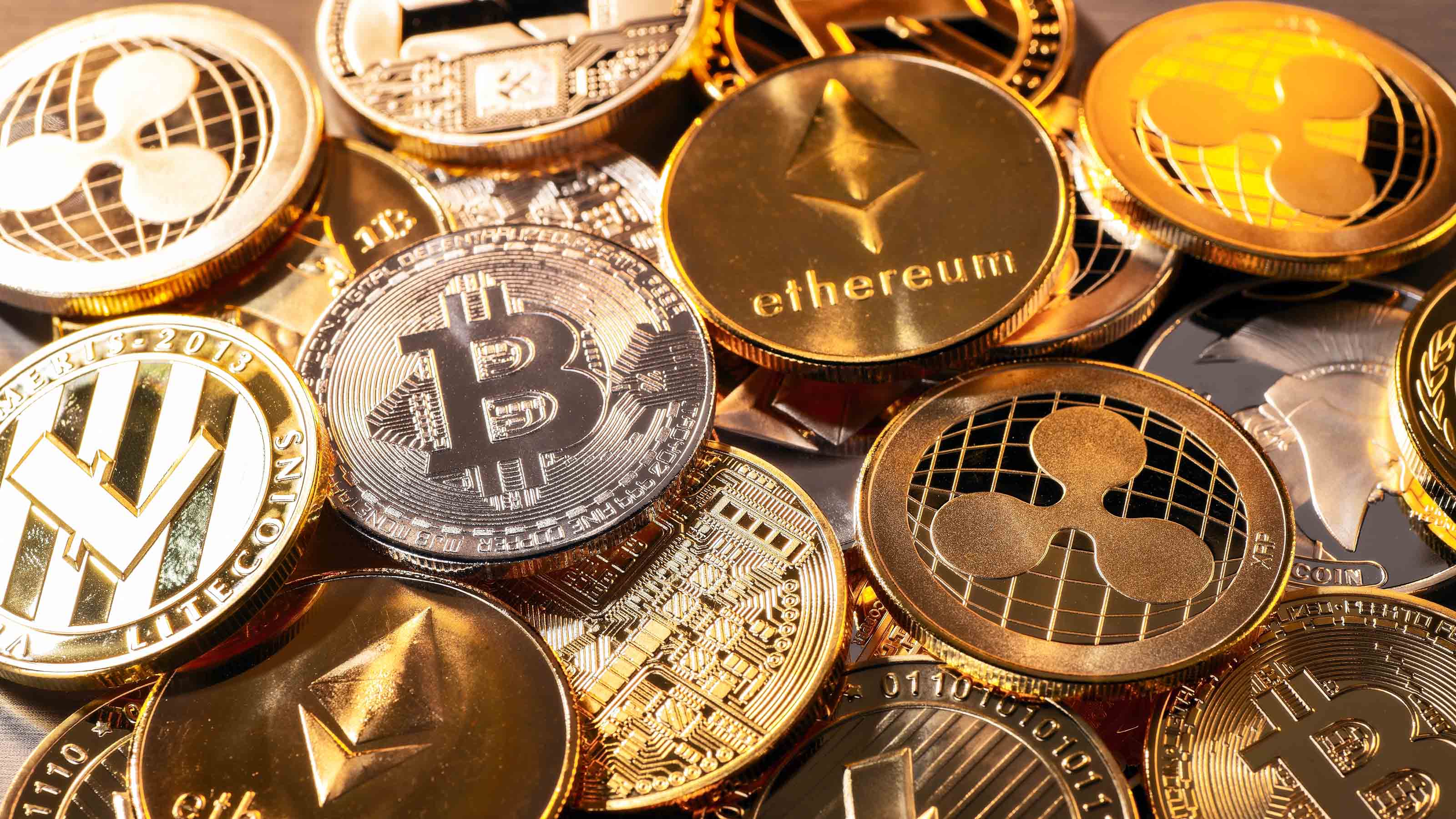 Bitcoin and Ethereum logos with 401(k) retirement documents